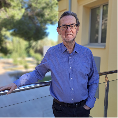 Man with glasses and blue shirt